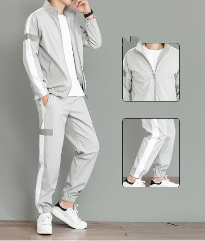 Casual wear trendy handsome guard clothes modeled by a young man in a stylish grey outfit with white accents.